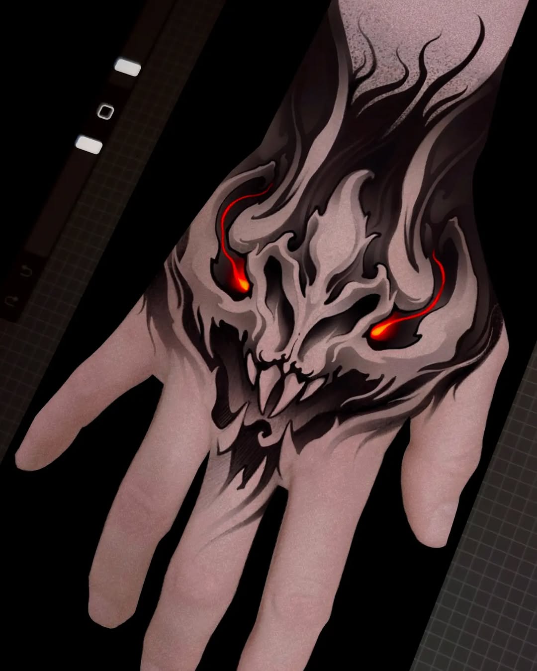Demonic skull with glowing red eyes and flowing hair-like flames on the back of a hand, rendered in black and grey shading.