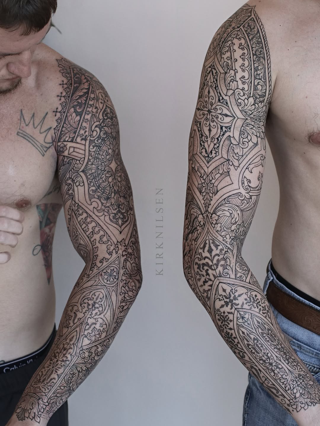 Ornate symmetrical mandala sleeve tattoos with intricate floral and scrollwork patterns covering both arms.