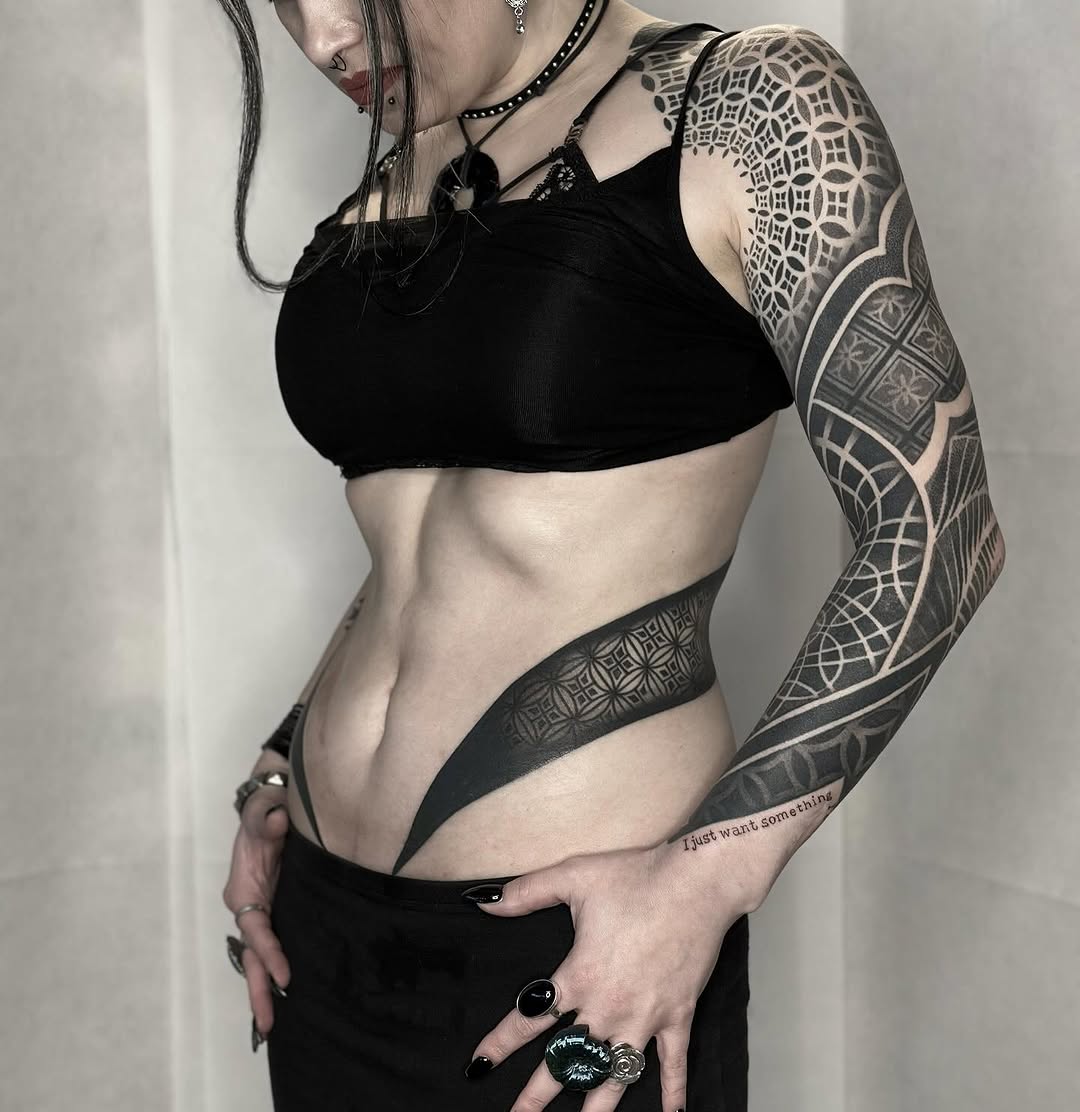 Full sleeve and torso geometric mandala and ornamental pattern tattoos in black ink with symmetrical linework and dotwork detail.