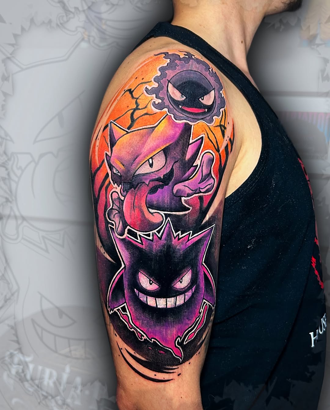 Three stacked Pokémon characters with vibrant orange, purple, and pink gradient background on upper arm.